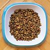 How can I make dry food more appealing to my dog